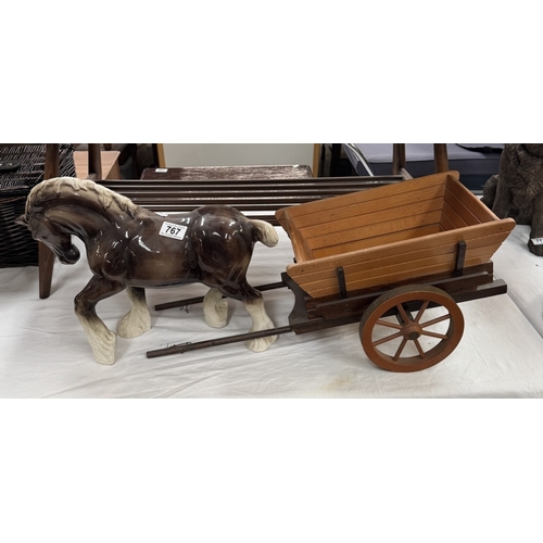 767 - A large pottery shire horse with haycart