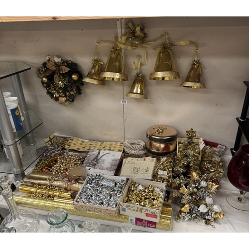 776 - A quantity of gold coloured Christmas decorations