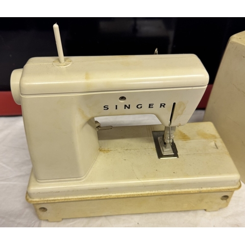 453 - A small cased Singer sewing machine