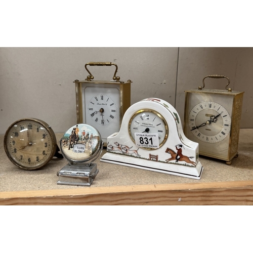 831 - A vintage perpetual calendar with hunting scene & a selection of clocks