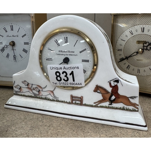 831 - A vintage perpetual calendar with hunting scene & a selection of clocks