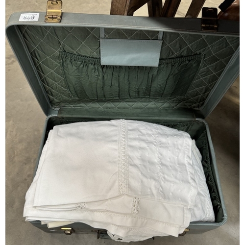 859 - A vintage suitcase of linens & a new blanket