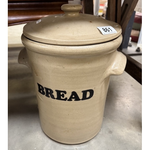 861 - A vintage bread crock (Lid has chip to rim)