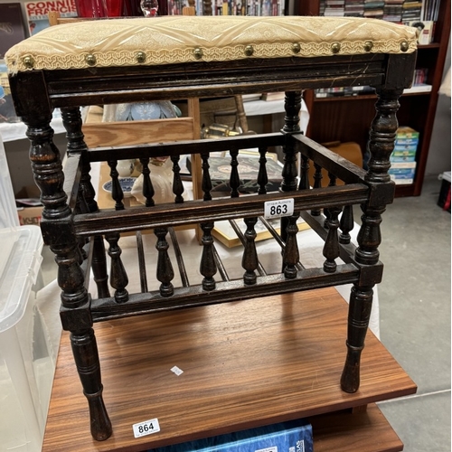 863 - An Edwardian piano stool with music book shelf