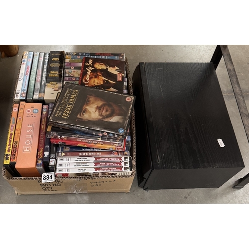 884 - A box of DVDs & a case of vintage music cassettes