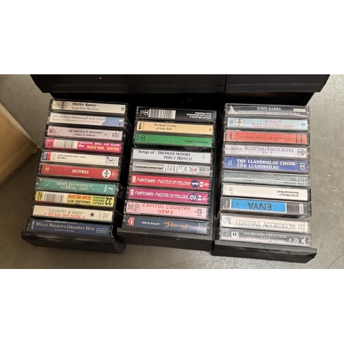 884 - A box of DVDs & a case of vintage music cassettes