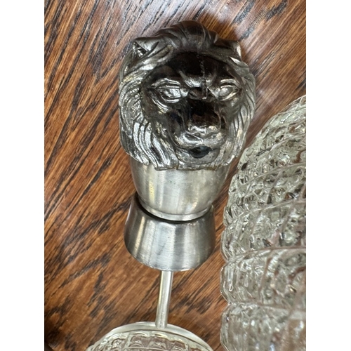 885 - 2 Moulded glass decanters & 3 novelty metal bottle stopper pourers including 2 knights & 1 lion