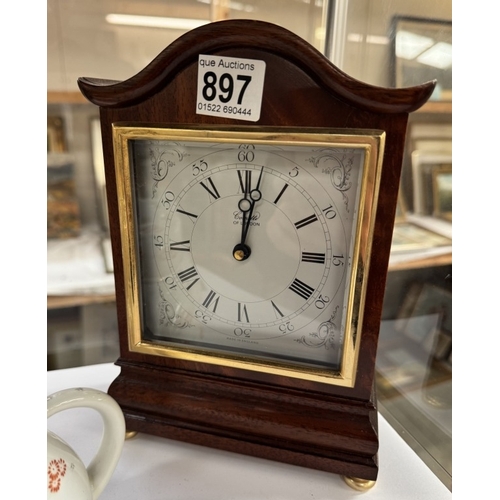 897 - A Comitti of London quartz mantel clock