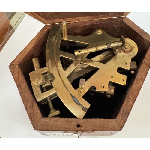 900 - A mini sextant in hard wood case