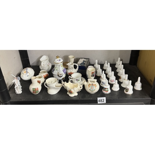 482 - A quantity of crested China and ceramic bells,