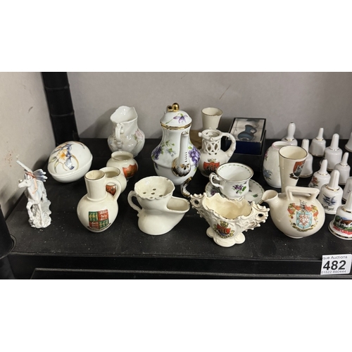 482 - A quantity of crested China and ceramic bells,