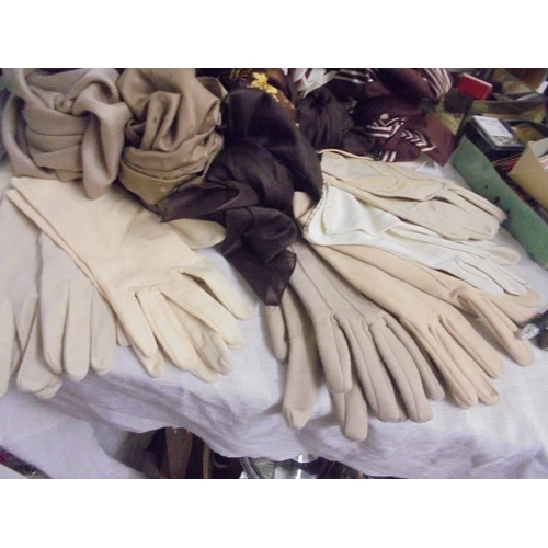 537 - A mixed lot of vintage gloves, scarves etc.,