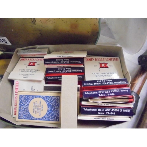 538 - A mixed lot including match books etc.,