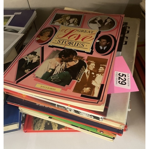 529 - A collection of books and photographs including images of Lady Diana etc