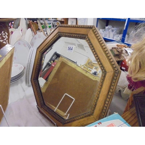 564 - An Edwardian oak octagonal mirror, in good condition, COLLECT ONLY.