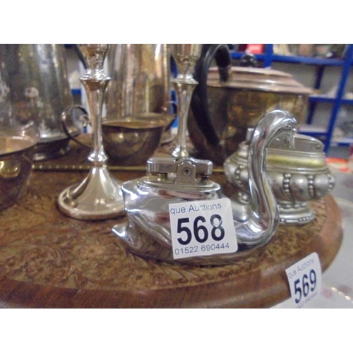 568 - A mixed lot of silver plate including swan shaped lighter etc.,