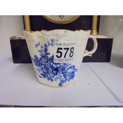 578 - An early 20th century blue and white moustache cup in good condition.