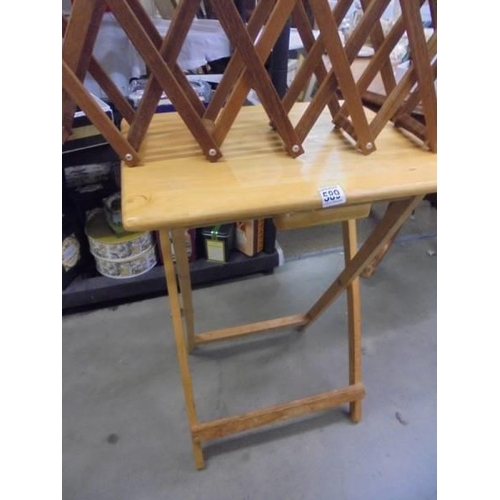 589 - A folding table and a folding wine rack. COLLECT ONLY.