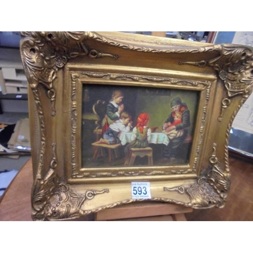 593 - A gilt framed overpainted print of dining scene.