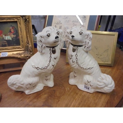 594 - A pair of 20th century Staffordshire spaniels.