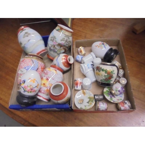 598 - A mixed lot of small Chinese vases, porcelain thimbles etc.,