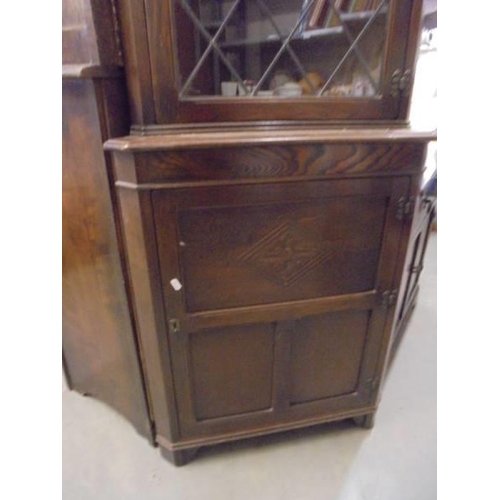 603 - A 20th century oak corner cabinet, COLLECT ONLY.