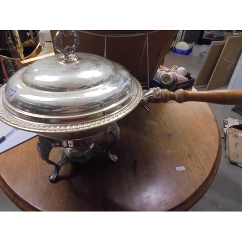 613 - A silver plate entree dish with glass liner and complete with burner.