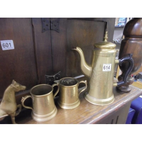 614 - A mixed lot of brass ware including coffee pots.