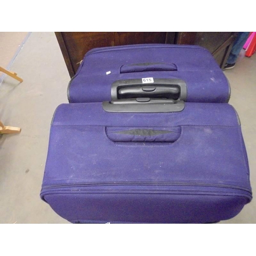 615 - A pair of good clean suitcases. COLLECT ONLY.