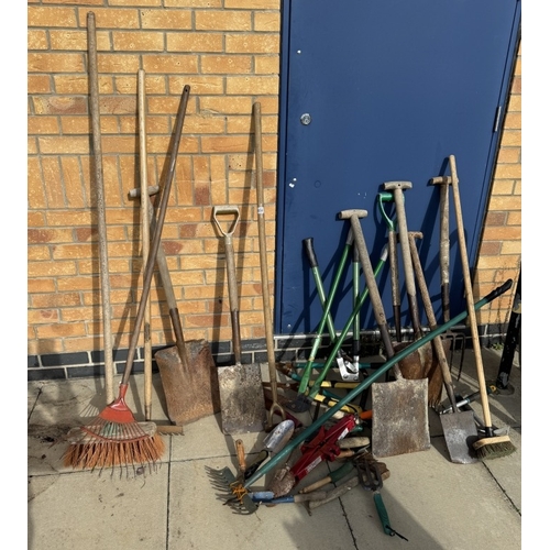 656 - A large assortment of garden tools