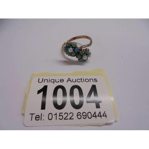 1004 - An Edwardian yellow gold turquoise and pearl ring, size P half, 3.1 grams.