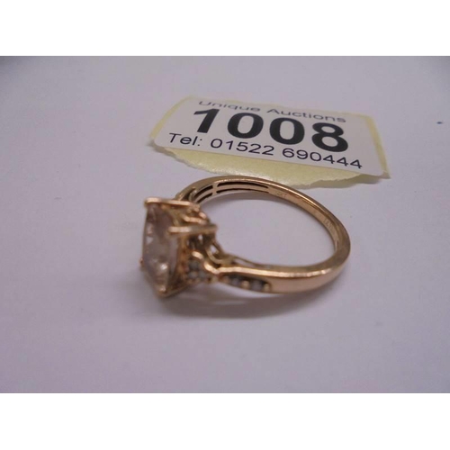 1008 - A 14ct yellow gold morganite and diamond ring, size M half, 2.7 grams.