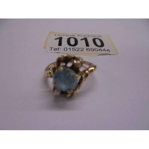 1010 - A 10ct yellow gold aqua and pearl ring, size L, 2.83 grams.