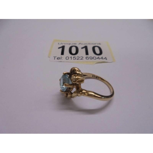 1010 - A 10ct yellow gold aqua and pearl ring, size L, 2.83 grams.