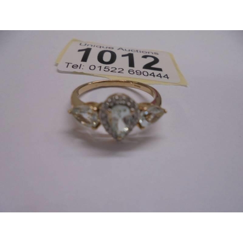 1012 - A pear shaped yellow gold topaz and diamond ring, size N, 2.4 grams.