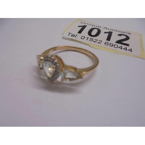 1012 - A pear shaped yellow gold topaz and diamond ring, size N, 2.4 grams.