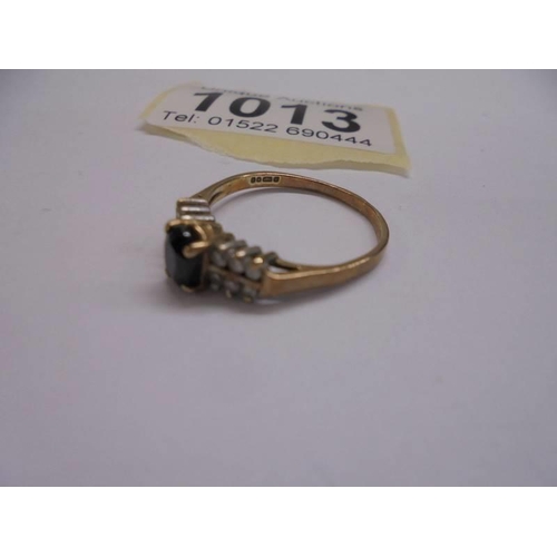 1013 - A 9ct yellow gold pinnacle sapphire side diamond ring, size O, 1.9 grams.