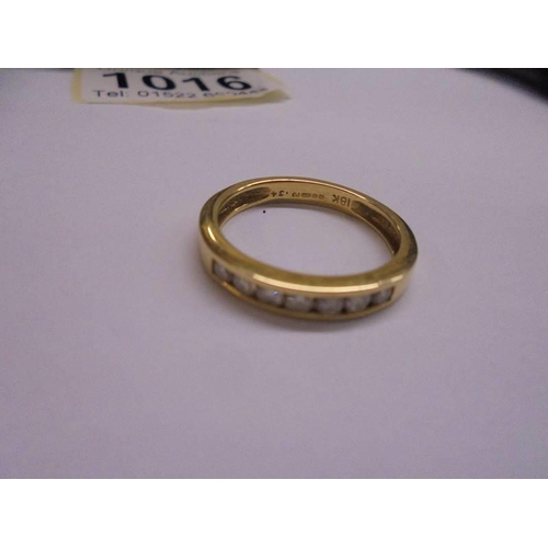 1016 - A 9ct gold half eternity ring set diamond chips, size P, 3.8 grams.