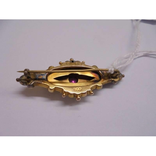 1017 - A Victorian 9ct gold brooch set amethyst and seed pearls, 5 cm wide, 3.98 grams.