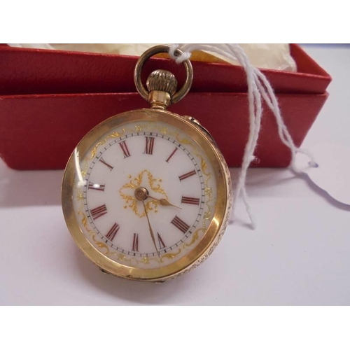 1018 - A 14ct gold cased ladies fob watch with enamelled dial, 34mm diameter, total weight 29 grams.