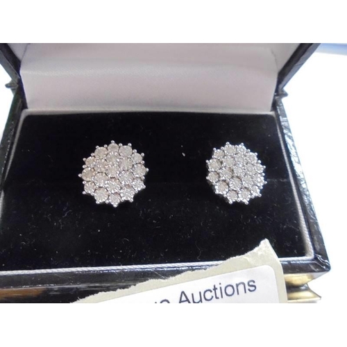 1019 - A pair of white 9ct gold fine diamond earrings, total weight 5 grams.