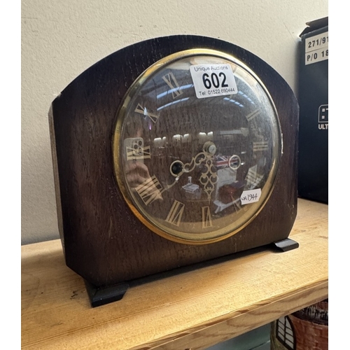 602 - An Edwardian oak mantle clock