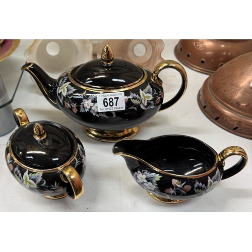 687 - A vintage Sadler black glazed ceramic tea set with gilded highlights & floral decoration COLLECT ONL... 