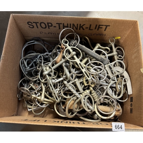 664 - A box of horse stirrups & bits etc