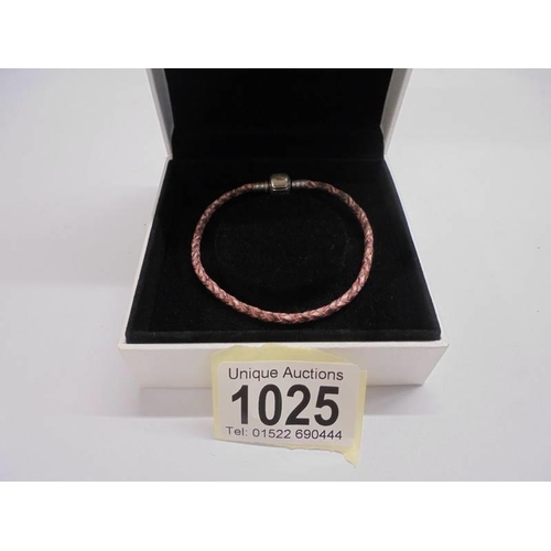 1025 - A genuine Pandora bracelet with sterling silver clasp in original box.