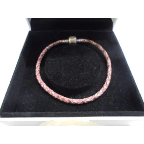 1025 - A genuine Pandora bracelet with sterling silver clasp in original box.