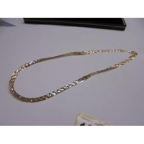 1026 - A plated rose gold and silver necklace.