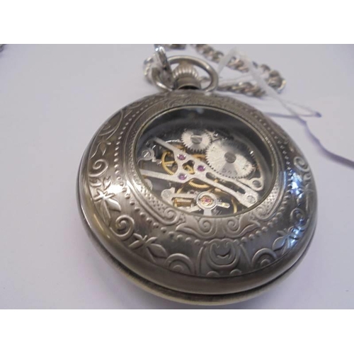 1027 - An open escapement pocket watch on chain, in working order.