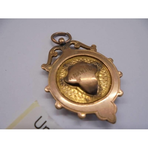 1028 - A 9ct gold watch fob, 6.9 grams.