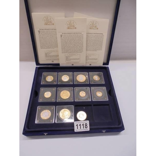 1118 - Eight cased Queen Elizabeth II gold plated coins and a Victorian coin.